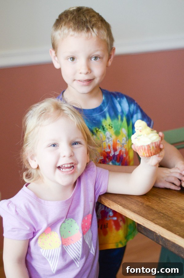 Fresh Bloom Cupcakes 8 A child looking intently at a mixing bowl filled with cupcake batter, learning the ropes of baking and focusing on the task.