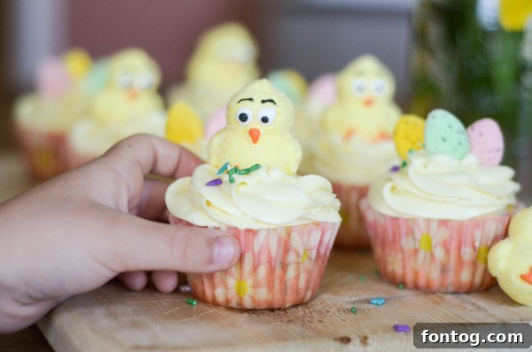 Fresh Bloom Cupcakes 9 A child's happy and engaged face while participating in a fun baking activity with family, surrounded by colorful cupcakes.