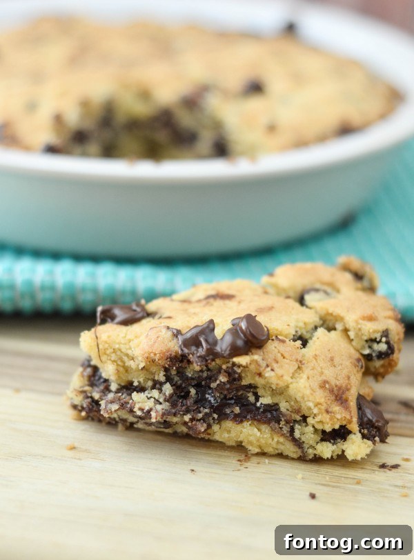 Ultimate Cookie Pie 5 Deep dish cookie served with melting vanilla ice cream and chocolate sauce