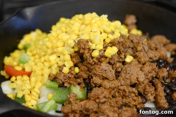 Fresh and vibrant ingredients for a delicious Mexican Rice Casserole, including ground beef, rice, black beans, corn, and colorful bell peppers.