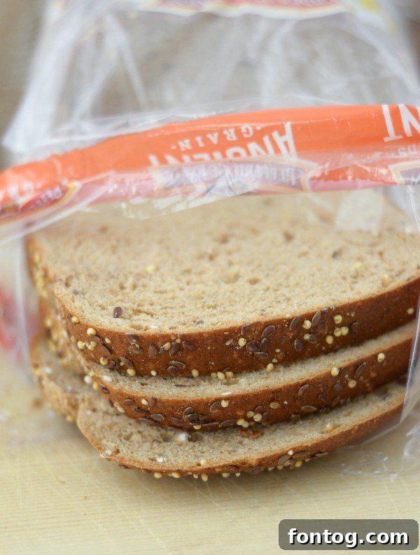 A stack of Pepperidge Farm Harvest Blends bread slices ready for sandwich making.