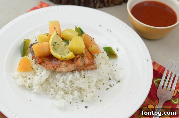 Serving of Maple BBQ Glazed Salmon with a side of dipping sauce