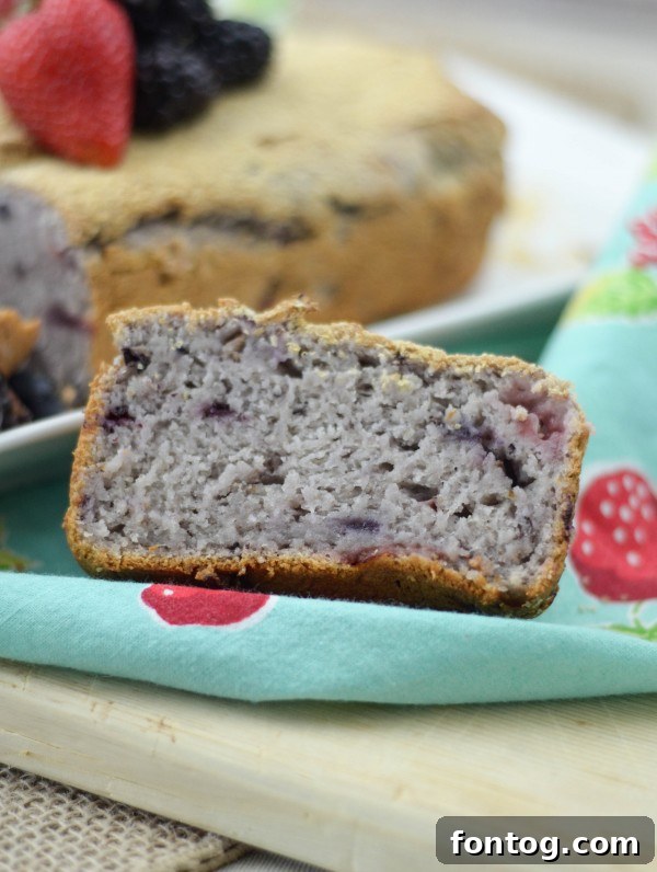 Close-up of the crumb of Berry Oatmeal Bread, showing the even distribution of oatmeal and berries.