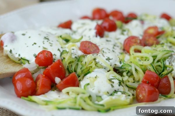 Fresh zucchini, grape tomatoes, and green onions for zoodles