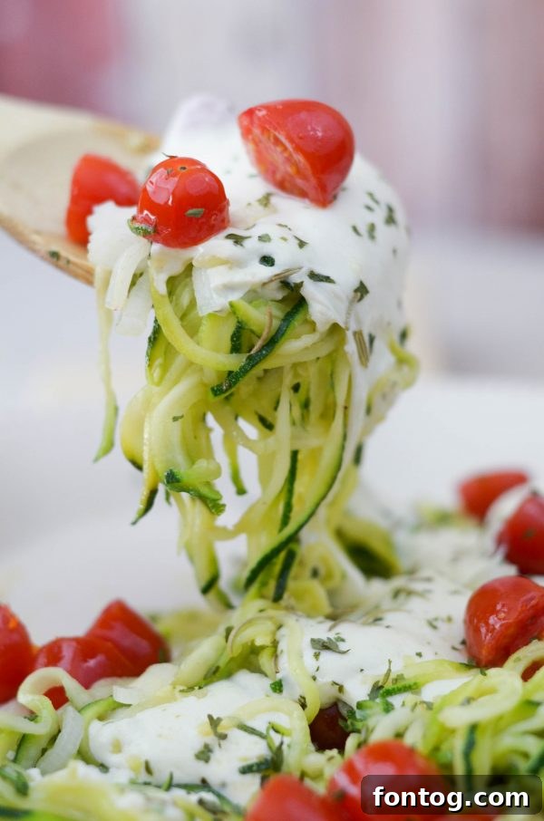 Close-up of Cheesy Baked Zoodles in a skillet