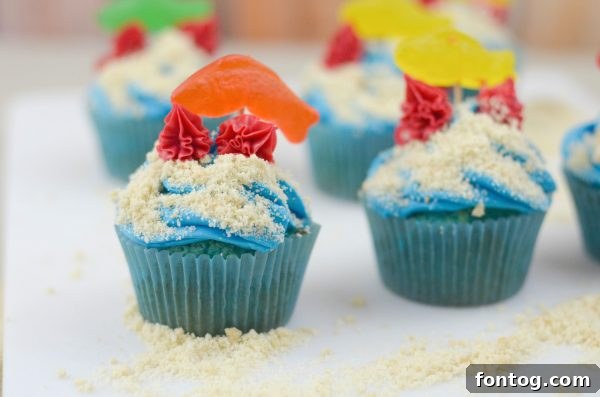 Ocean Friends Cupcakes - Detailed shot of one cupcake with a Swedish Fish and red coral