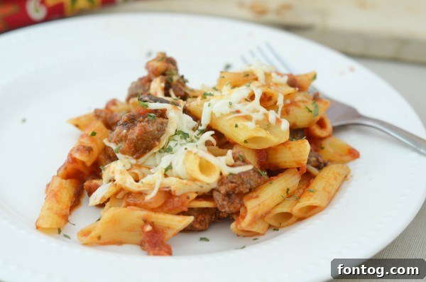 Golden Baked Cheesy Penne 7 Overhead view of Homestyle Cheesy Penne with fresh herbs