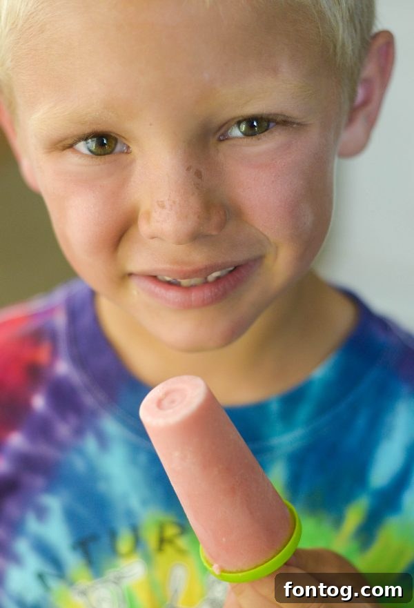 A collection of homemade Watermelon Yogurt Pops, showcasing their vibrant color and readiness for a hot day.