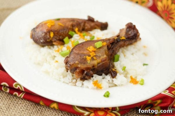 Serving of Slow Cooker Orange Chicken with Rice and Steamed Broccoli