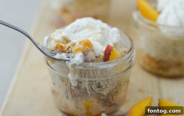 Closeup of Peach Cobbler in a Jar with crumb topping