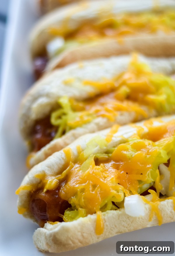 Grilled sausage links with peppers and onions