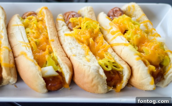 Close-up of grilled sausage links with cheese