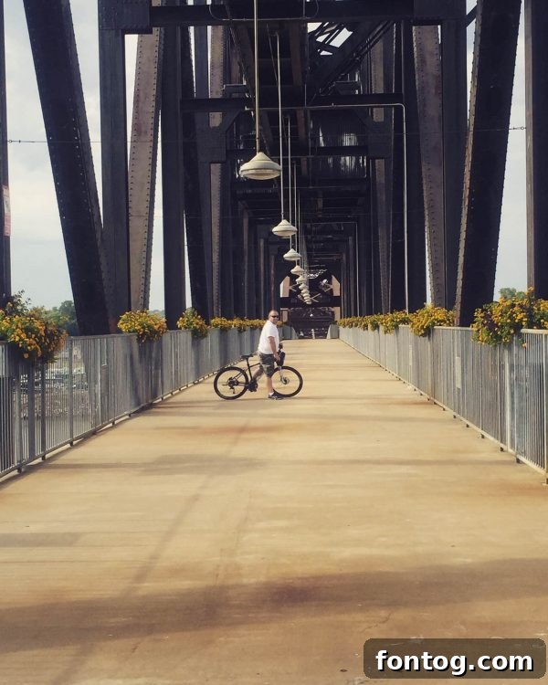 The stunning Clinton Presidential Bridge on the Arkansas River Trail in North Little Rock, ideal for biking and walking. #ExploreNLR #ad