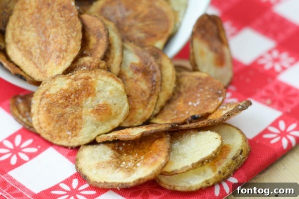 Thinly and uniformly sliced raw potatoes, ready for seasoning