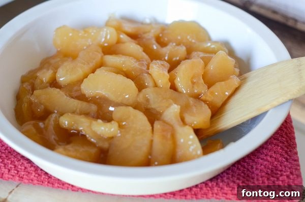 Close-up of the caramel apple crisp, showcasing the rich filling and golden topping