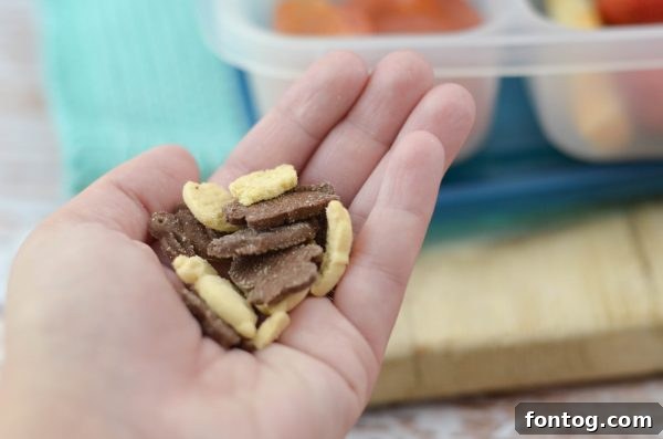 A child happily showing off a Box Tops for Education product in a Sprouts store, illustrating active family participation in school support.