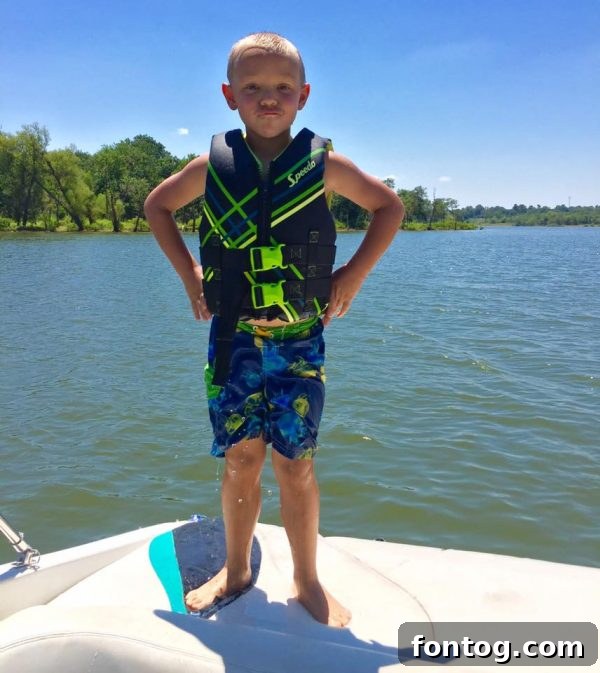 Dakota enjoying a day at the lake, free from motion sickness thanks to Dramamine for Kids