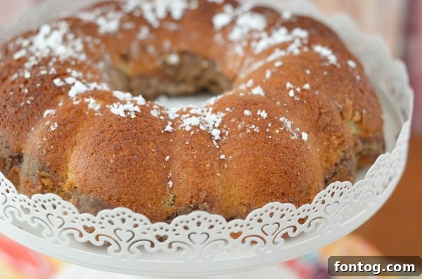 A slice of Sour Cream Coffeecake on a plate