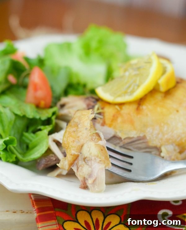 Fresh rosemary sprigs and Pompeian Red Wine Vinegar bottle