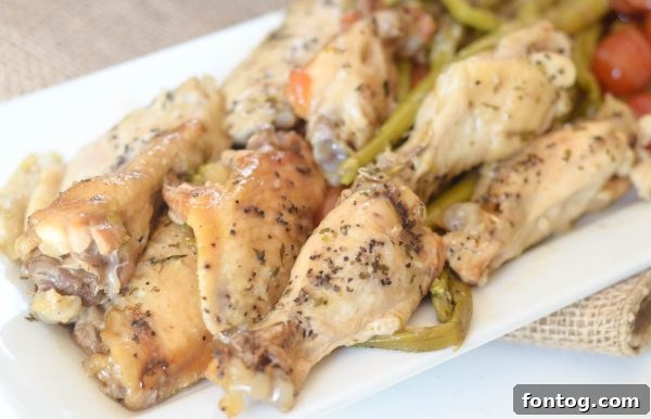 Slow Cooker Lemon Pepper Chicken with vibrant asparagus and tomatoes