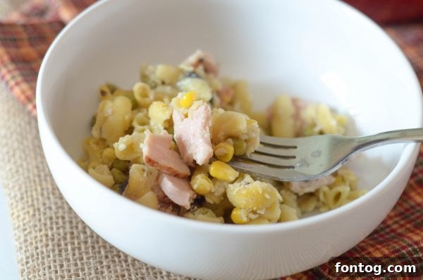 Mixing ingredients for homemade Turkey Noodle Casserole