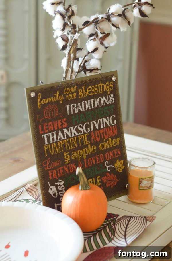 5 Essential Dinner Party Hacks 5 A beautifully set fall-themed table with placemats, plates, and centerpieces, all sourced from Dollar General.