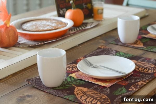 5 Essential Dinner Party Hacks 6 A festive dessert spread featuring a pumpkin pie on a decorative plate, surrounded by autumnal touches.