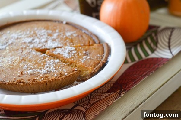 5 Essential Dinner Party Hacks 7 A festive table centerpiece with fall leaves and candles, highlighting Dollar General's decorating options.