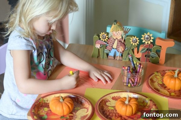 A close-up of kid-friendly Thanksgiving desserts and drinks at the children's table.