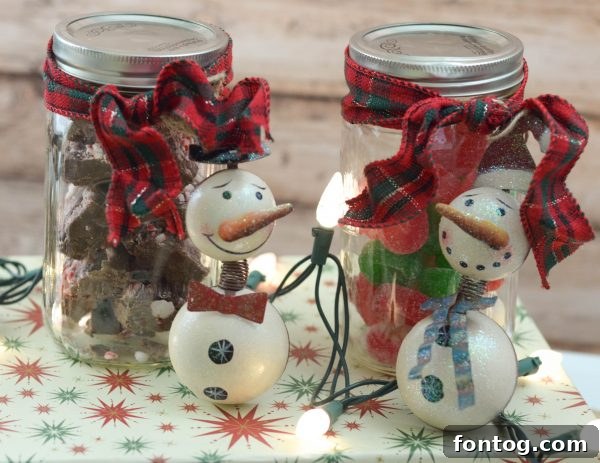 Handcrafted Jar Delights 8 Mason Jar Treat with rustic snowman, festive ribbon, and filled with delicious contents
