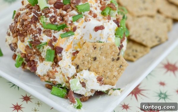 Bacon Ranch Cheese Ball on a serving platter with crackers for dipping