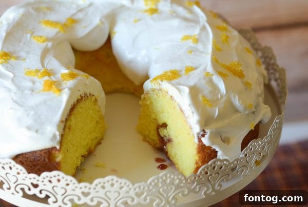 Close-up of a slice of Strawberry Jalapeño Cream Cheese Poke Cake