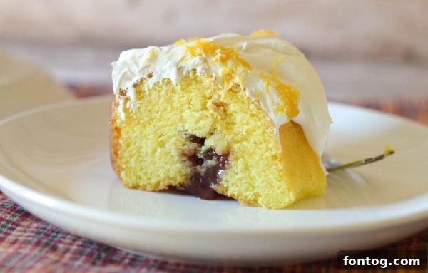 Strawberry Jalapeño Cream Cheese Poke Cake with a fork taking a bite