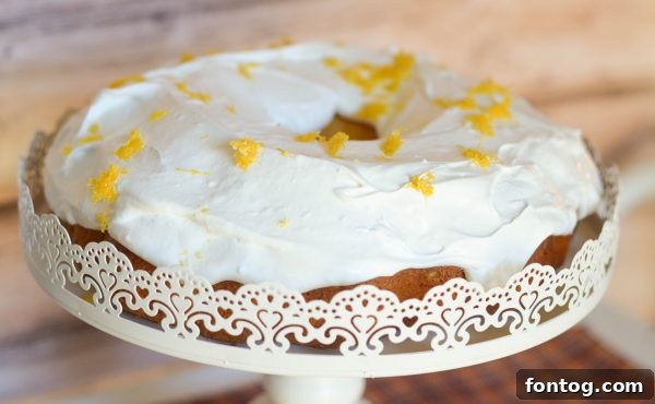 A beautifully presented slice of Strawberry Jalapeño Cream Cheese Poke Cake