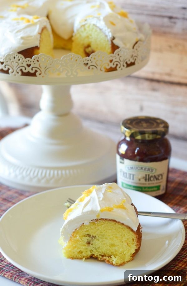 Whole Strawberry Jalapeño Cream Cheese Poke Cake with a knife for serving