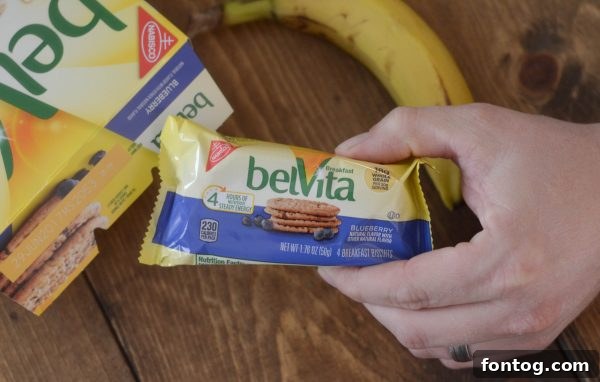 A box of belVita Breakfast Biscuits with fruit and milk