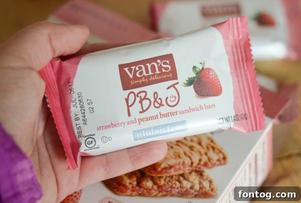 Enjoying Van's Strawberry & Peanut Butter Sandwich Bars as a satisfying snack