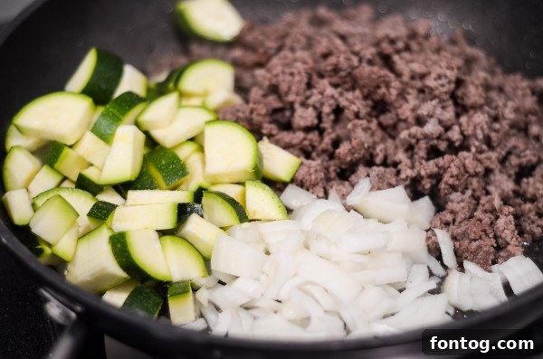 sliced eggplant on a baking sheet, ready for roasting