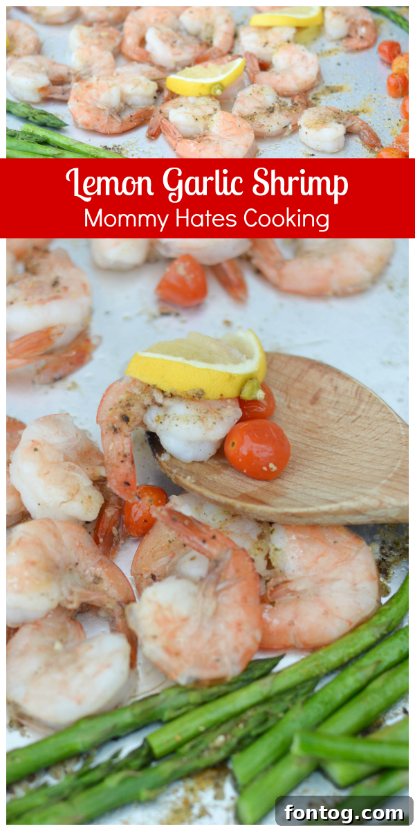 Sheet Pan Lemon Garlic Shrimp - A mouthwatering overhead shot of a sheet pan filled with golden-brown lemon garlic shrimp, perfectly roasted asparagus, and vibrant grape tomatoes, garnished with fresh herbs.