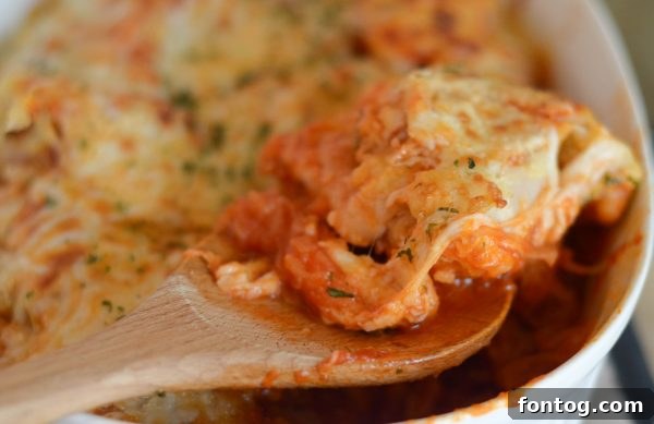 Wholesome Chicken Parmesan with Spaghetti Squash 3 Close-up of golden brown chicken parmesan over a bed of spaghetti squash