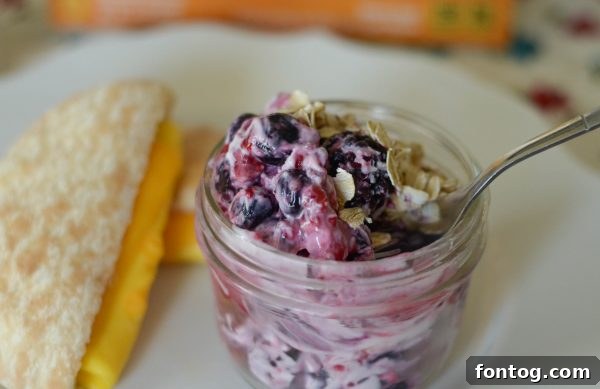 Close-up of Sandwich Bros. Egg & Cheese Sandwich and Fruit Salad