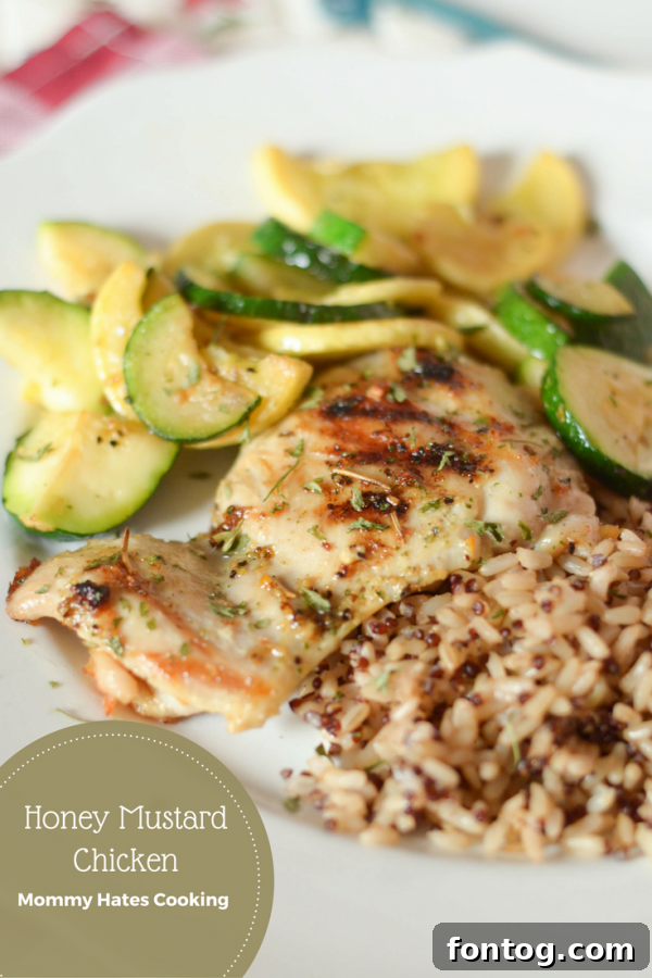 Delicious Honey Mustard Chicken served with fresh rosemary and a side of rice