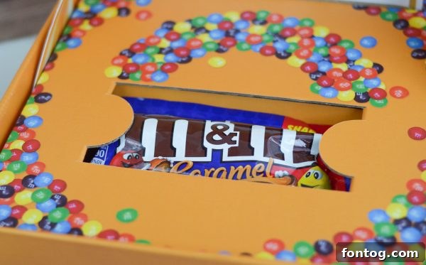 M&MS Caramel Cookie Parfaits: Indulge and Win 5 Three M&M'S® Caramel Cookie Parfaits arranged artfully, featuring their colorful candy toppings and drizzle.