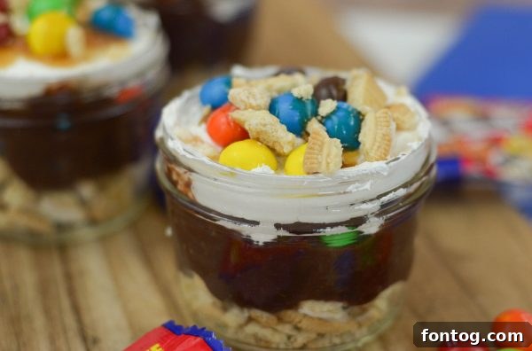 M&MS Caramel Cookie Parfaits: Indulge and Win 6 A vibrant M&M'S® Caramel Cookie Parfait presented in a small glass jar, perfect for individual servings.