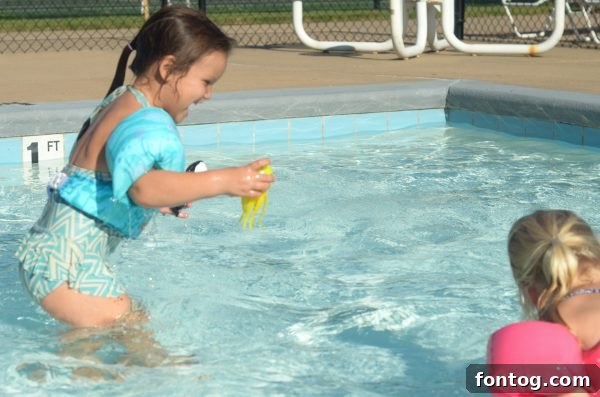 Children playing with various Lil' Fishys characters, including an octopus and a fish