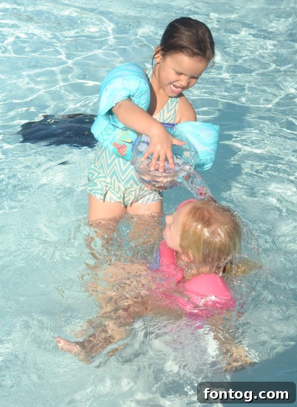A child happily playing with Lil' Fishys toys in a small, portable fish tank