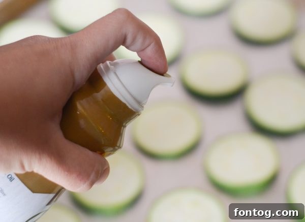 Multiple Zucchini Pizza Bites arranged on a wooden board, showcasing their vibrant colors