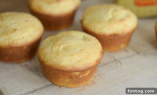 Gluten-Free Corn Dog Muffins with dipping sauces on a table.