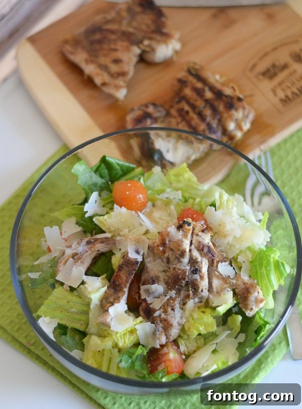 Sliced blackened chicken served over a fresh Caesar salad