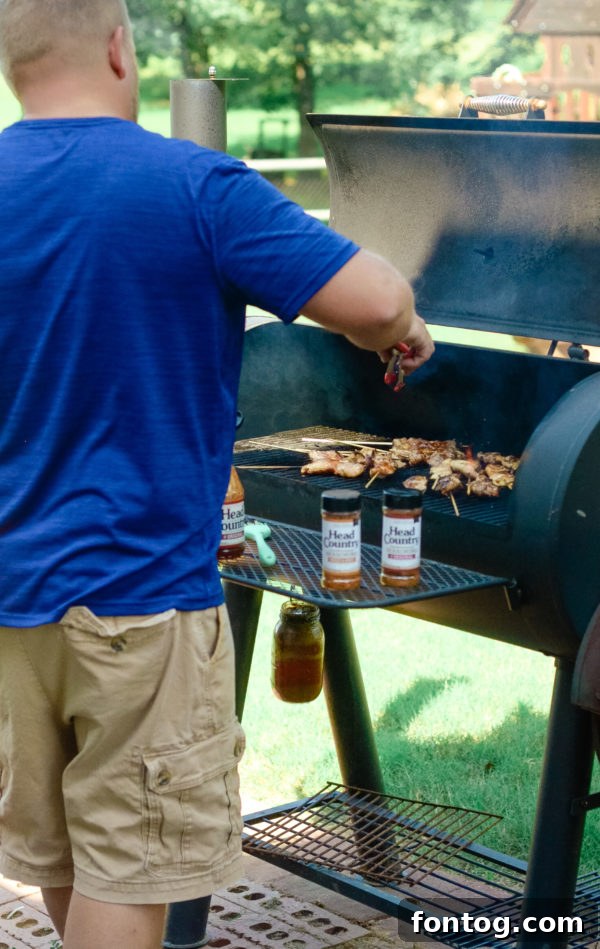 Zesty Grilled Chicken Skewers Gluten Free 4 Prepared barbecue chicken skewers marinating in sauce within a glass dish, ready for refrigeration or grilling.